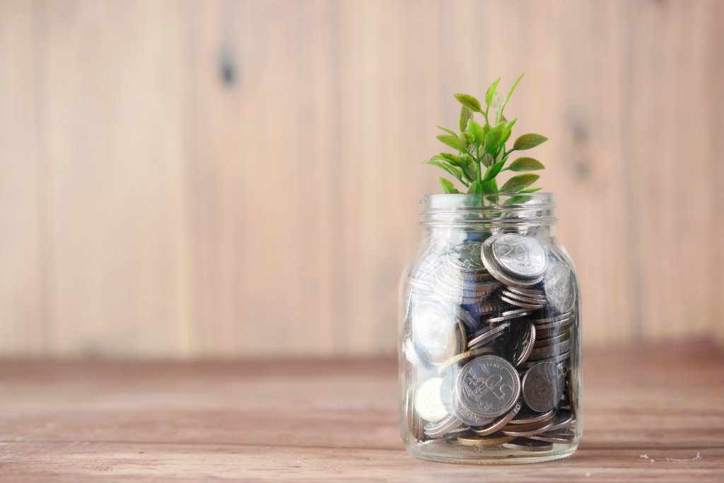 jar of money - saving money with geothermal heating