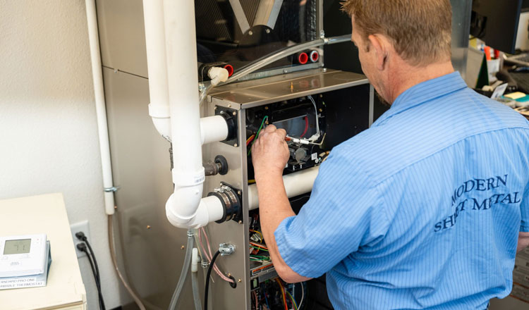 Furnace Installer Working on Furnace